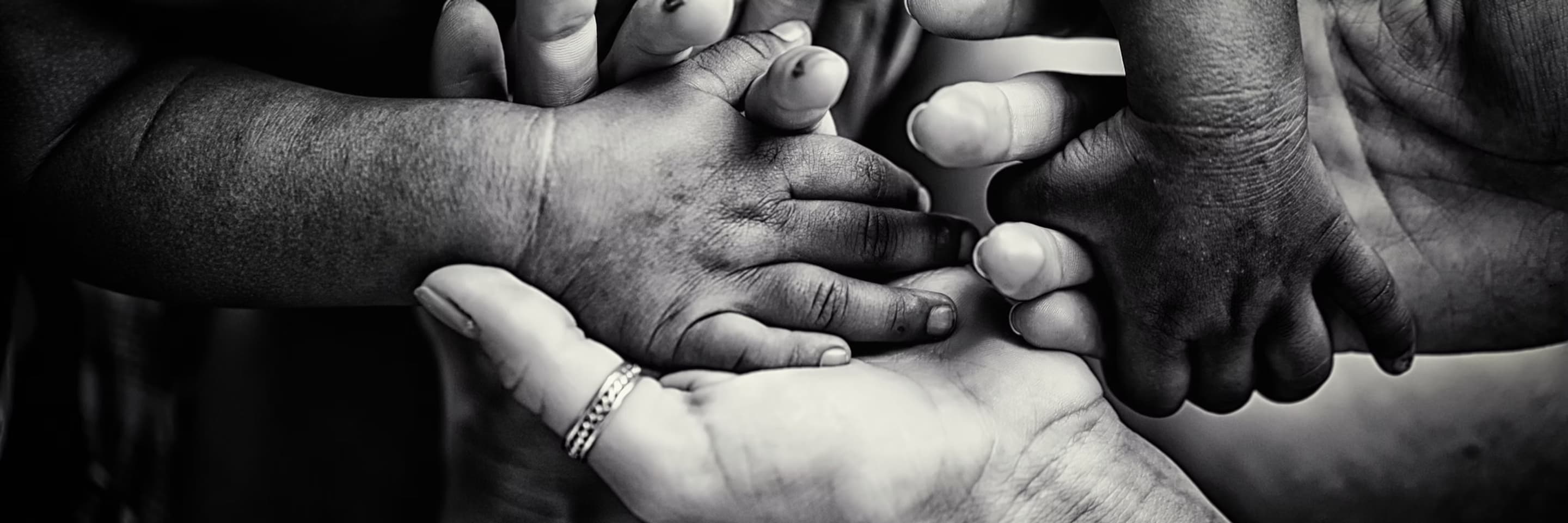 Hands of several generations held together